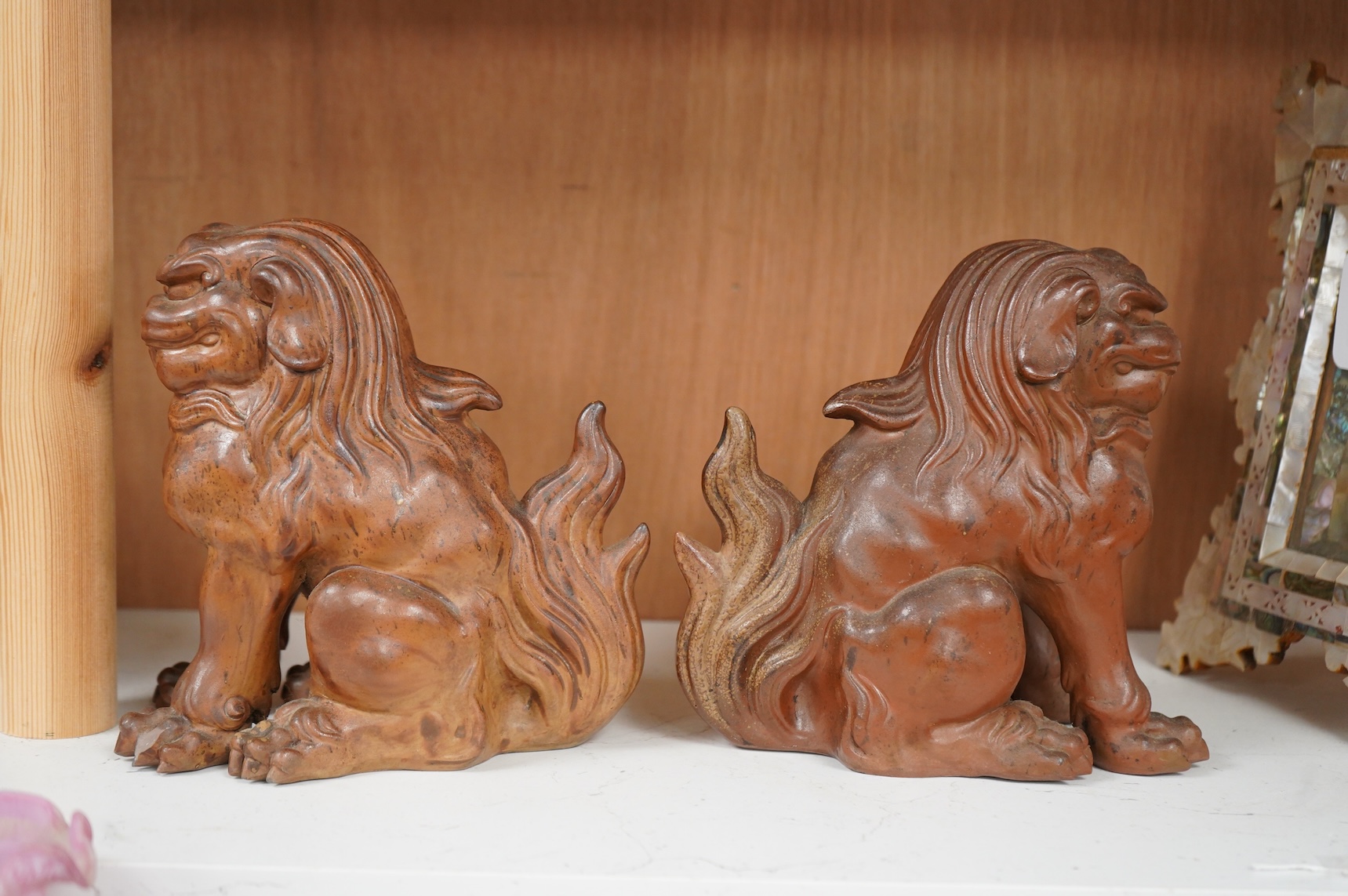 A pair of Japanese Bizan ware lion dogs (shi shi), 18cm high